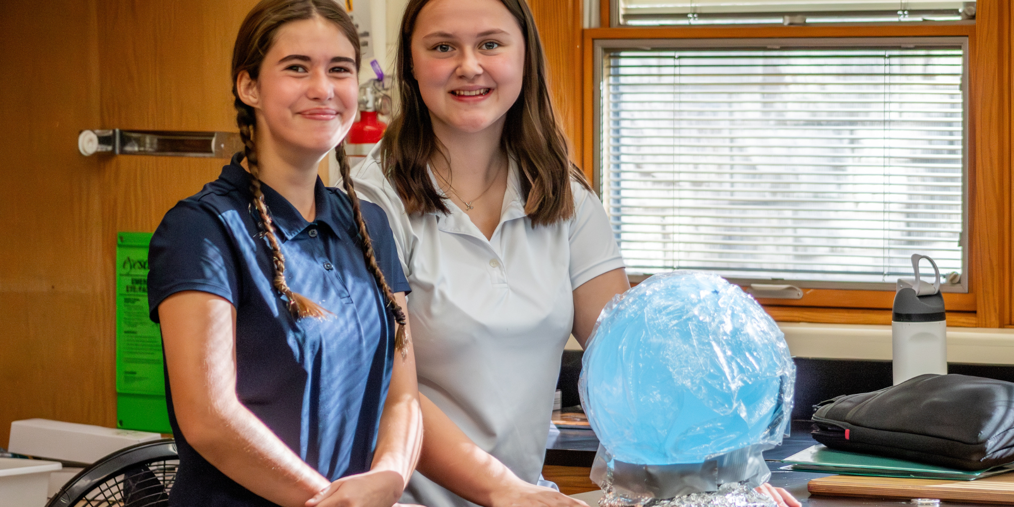 Two HFS students standing with science experiment